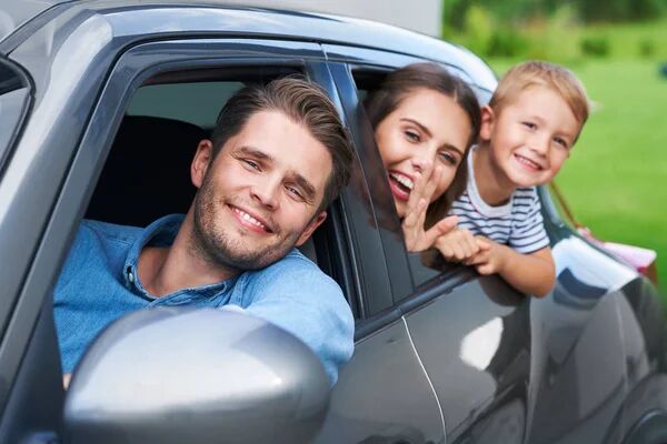 depositphotos_308076224-stock-photo-family-sitting-in-the-car.jpg