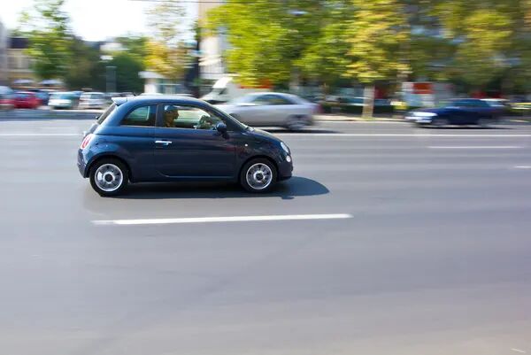 depositphotos_11644673-stock-photo-small-car-running-on-the.jpg